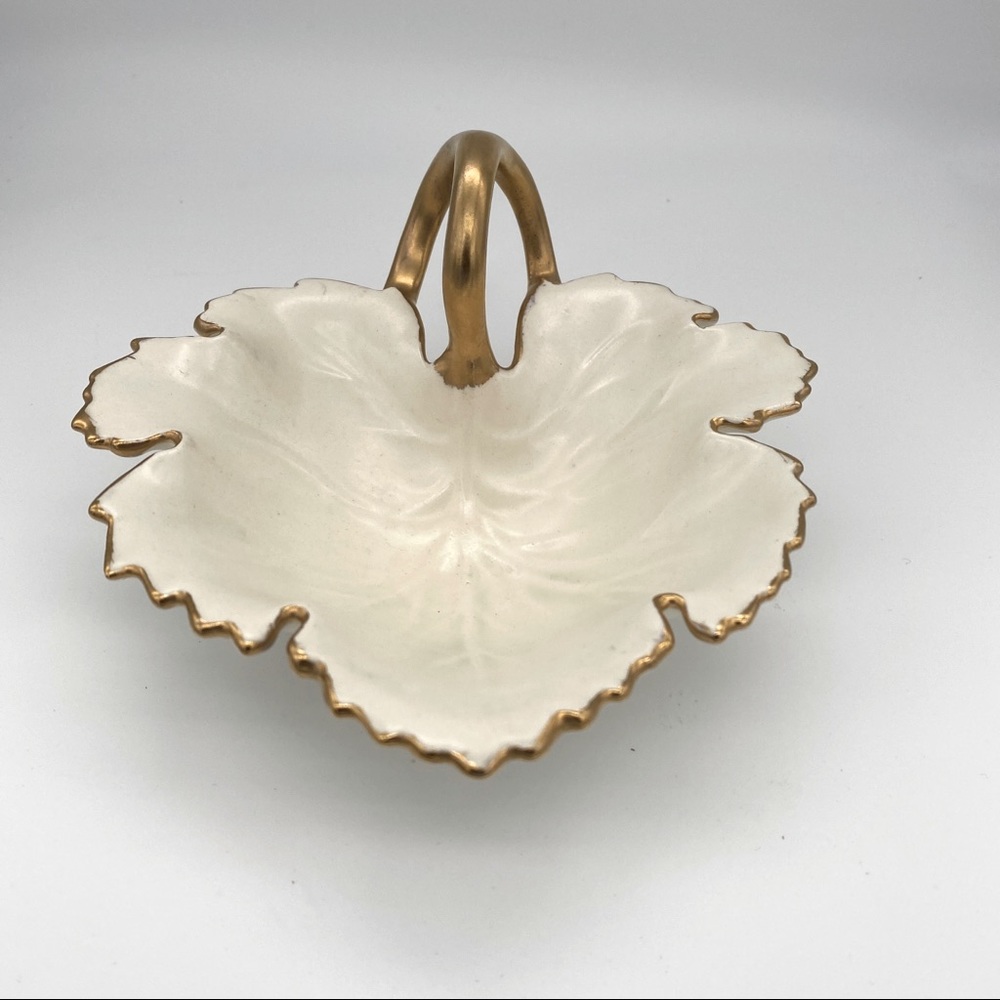 Vintage leaf shaped with gold trim dish.‎